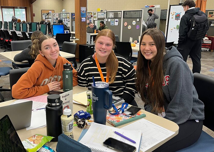 Students sitting at table in the ASC