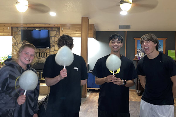 Students holding cotton candy